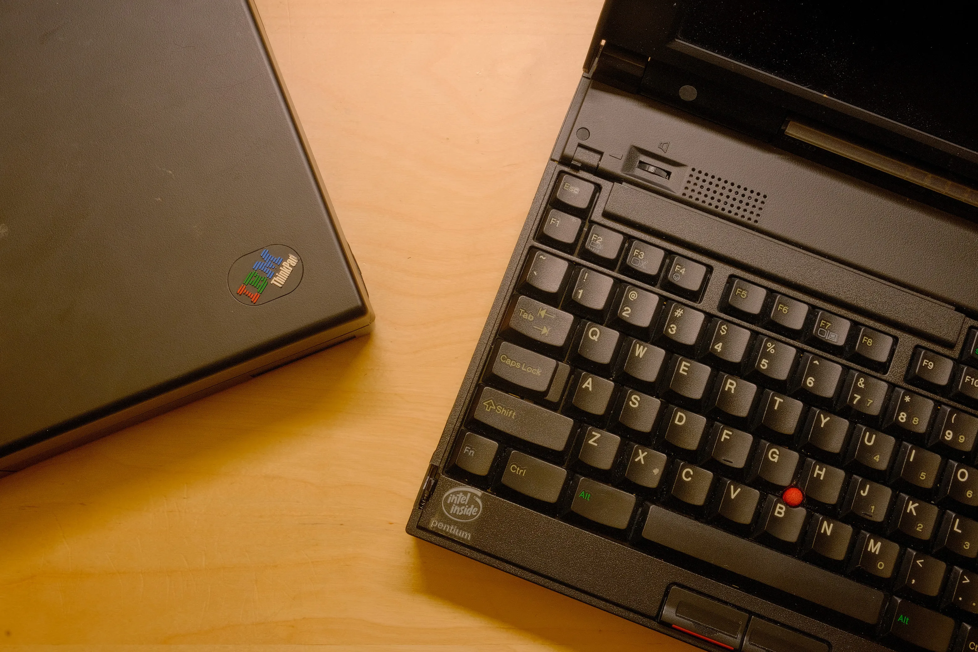 Vintage ThinkPad on a dark desk